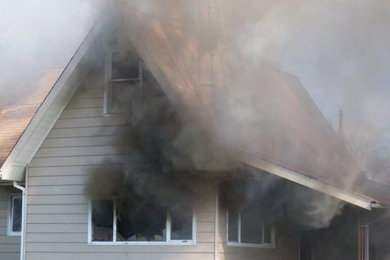 Thick smoke engulfs a home, foreshadowing the blazing destruction to come.