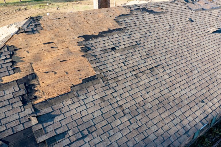 Roof and shingles damaged by tornado during severe weather